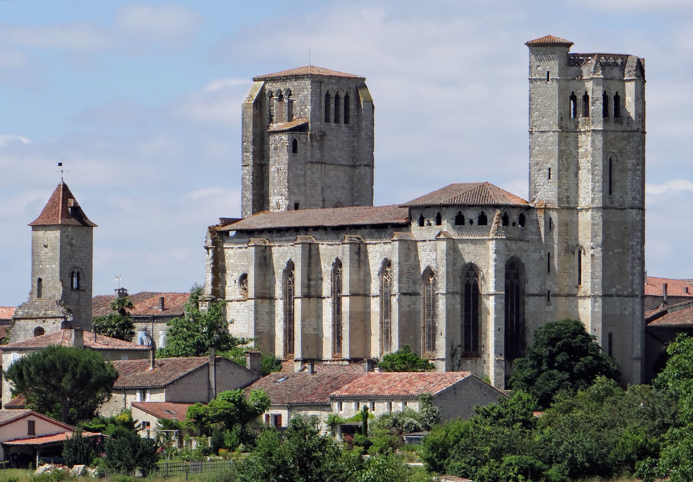The collegiate church at La Romieu, its square belfry and octagonal tower rising above the village rooftops