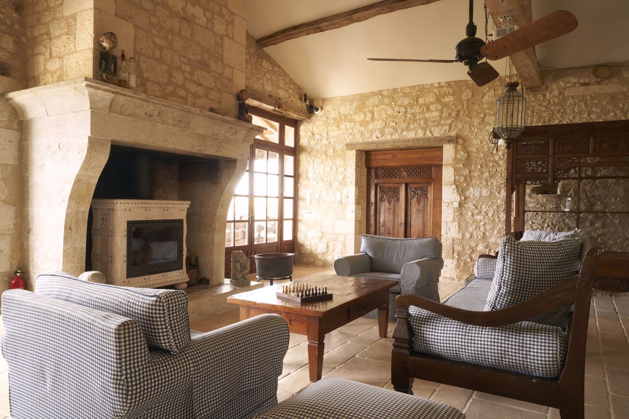 The living room fireplace with deep armchairs drawn up to it