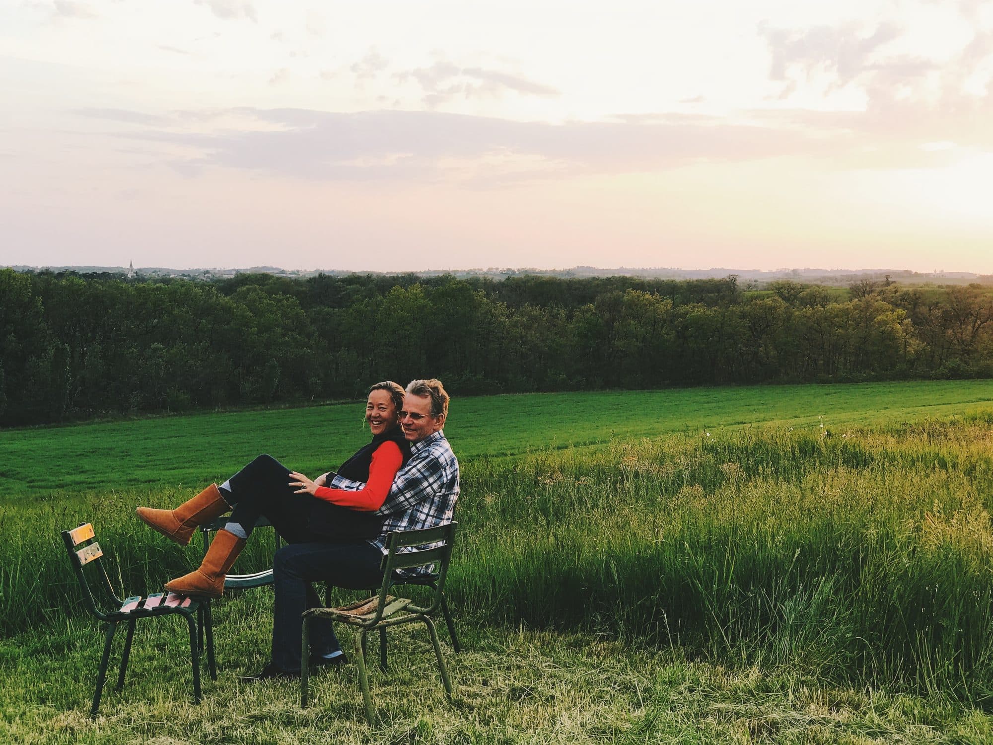 Hans and Pascale, sitting out in the field below the house at sunset