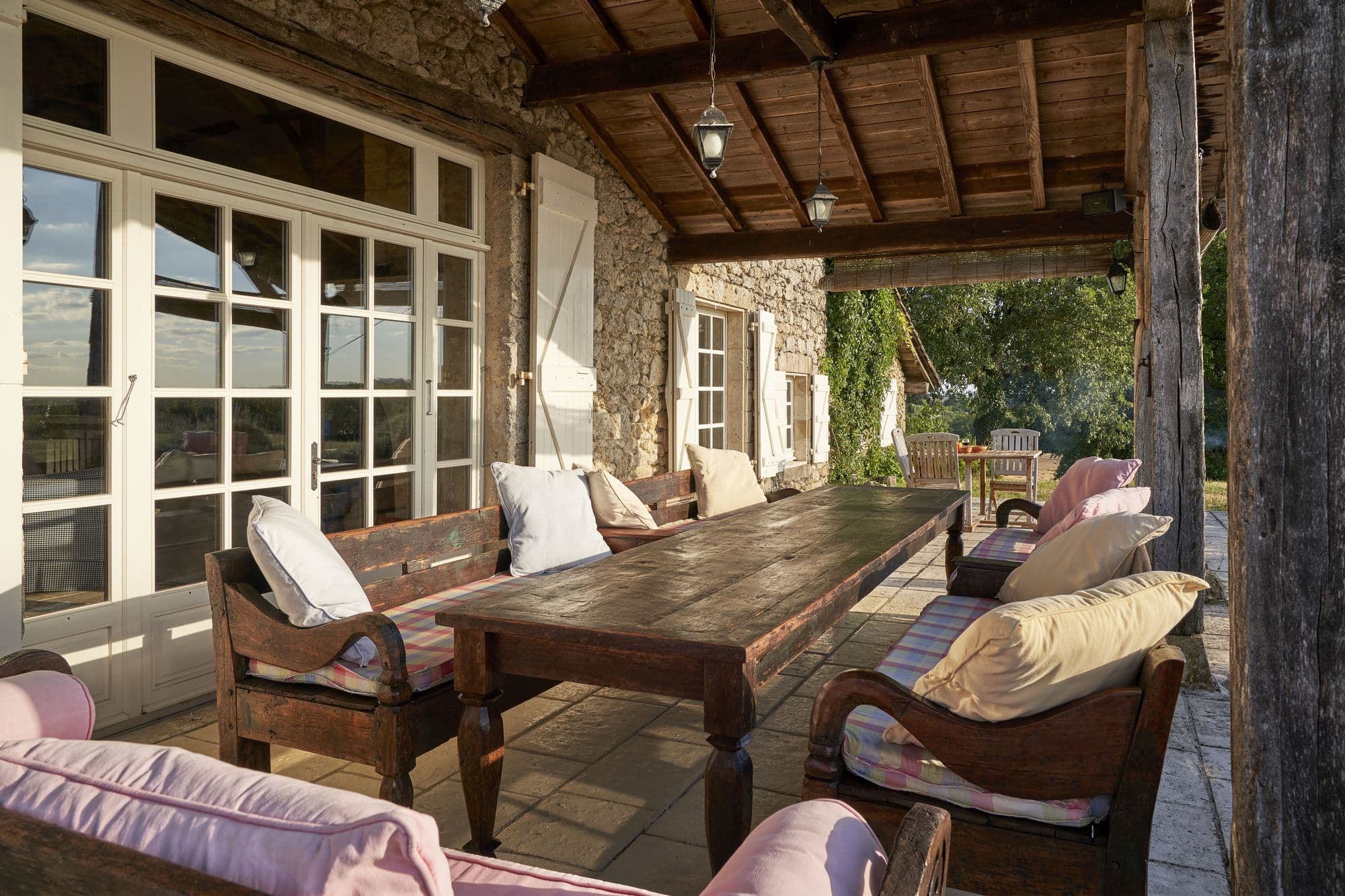 The covered terrace running along the south side of the house